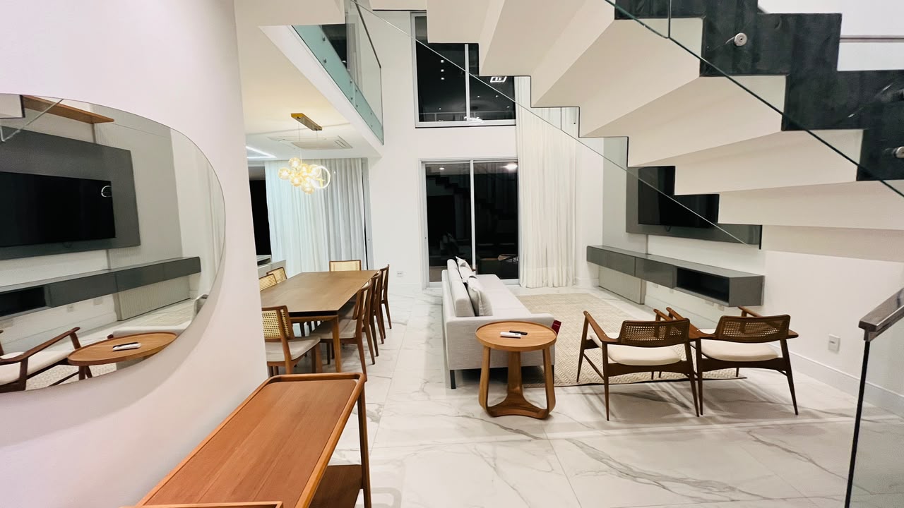 Sala de estar integrada com pé-direito duplo